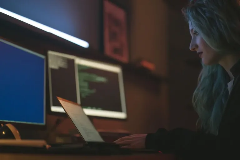 Engineer monitoring screens from a laptop